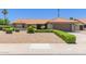 Inviting single-story home with a low-maintenance desert landscape and charming orange tile roof at 6017 E Kathleen Rd, Scottsdale, AZ 85254