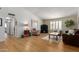 Open-concept living room with hardwood floors, neutral decor, and inviting furniture arrangement at 6017 E Kathleen Rd, Scottsdale, AZ 85254