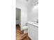 Updated bathroom with modern fixtures, vanity with storage, and luxury vinyl plank flooring at 6537 W Pioneer St, Phoenix, AZ 85043