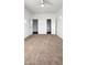 Carpeted bedroom with walk-in closets and natural light at 6537 W Pioneer St, Phoenix, AZ 85043