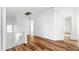 Bright upstairs hallway featuring luxury vinyl plank flooring and lots of natural light at 6537 W Pioneer St, Phoenix, AZ 85043