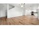 Open-concept living space featuring a ceiling fan and luxury vinyl plank flooring at 6537 W Pioneer St, Phoenix, AZ 85043