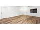 Bright living room featuring luxury vinyl plank flooring, decorative molding, and natural light at 6537 W Pioneer St, Phoenix, AZ 85043