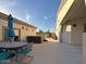 Outdoor patio with a dining area and hot tub, great for relaxation and entertainment at 661 W Via De Palmas --, San Tan Valley, AZ 85140