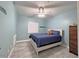 Cozy bedroom featuring neutral paint, ceiling fan, and a comfortably appointed queen-size bed at 661 W Via De Palmas --, San Tan Valley, AZ 85140