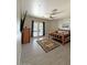 Bedroom with a log-style bed, ceiling fan, and sliding glass doors providing ample natural light at 661 W Via De Palmas --, San Tan Valley, AZ 85140