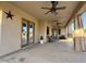 Relaxing covered patio features ceiling fans and a welcoming outdoor seating area at 661 W Via De Palmas --, San Tan Valley, AZ 85140