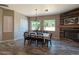 Bright dining room featuring a farmhouse-style table, pendant lighting, and stylish wood-look flooring at 661 W Via De Palmas --, San Tan Valley, AZ 85140