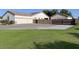View of a well-maintained home with a large garage and mature landscaping at 661 W Via De Palmas --, San Tan Valley, AZ 85140