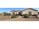 Charming single-story home featuring well-maintained landscaping and a welcoming entrance at 661 W Via De Palmas --, San Tan Valley, AZ 85140