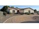 Charming single-story home featuring well-maintained landscaping and a welcoming entrance at 661 W Via De Palmas --, San Tan Valley, AZ 85140