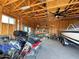 Interior of garage offering ample storage space with quads, dirt bikes and shelving units at 661 W Via De Palmas --, San Tan Valley, AZ 85140