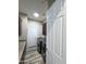 Well-lit laundry room features cabinets, a countertop, modern washer and dryer, and a door to the exterior at 661 W Via De Palmas --, San Tan Valley, AZ 85140