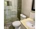 A bathroom featuring a glass door shower, with modern fixtures and marbled vanity at 753 W 6Th Dr, Mesa, AZ 85210