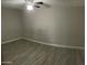 An empty bedroom, with a ceiling fan and tile floors at 753 W 6Th Dr, Mesa, AZ 85210