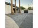Contemporary driveway with palm trees and decorative gravel offers stylish curb appeal at 753 W 6Th Dr, Mesa, AZ 85210