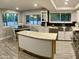 Bright kitchen with an island, stainless steel appliances, and lots of natural light at 753 W 6Th Dr, Mesa, AZ 85210