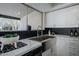 Kitchen featuring modern stainless-steel appliances, granite countertops, and sleek cabinetry at 753 W 6Th Dr, Mesa, AZ 85210