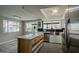 Bright kitchen featuring an island, stainless steel appliances, and ample cabinet space at 753 W 6Th Dr, Mesa, AZ 85210