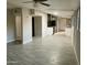 Open living space with tile flooring, seamlessly connecting to kitchen and hallways at 753 W 6Th Dr, Mesa, AZ 85210