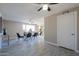 Spacious living room featuring modern furnishings, ample natural light, and tile flooring at 753 W 6Th Dr, Mesa, AZ 85210