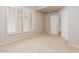 Bedroom featuring neutral carpeting and shuttered windows at 7621 S Bonarden Ln, Tempe, AZ 85284