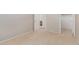 Bedroom featuring neutral walls, beige carpet, and access to a closet and bathroom at 7621 S Bonarden Ln, Tempe, AZ 85284
