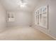 Spacious bedroom with neutral carpet, a ceiling fan, and plantation shutters at 7621 S Bonarden Ln, Tempe, AZ 85284