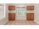 Charming breakfast nook with custom cabinets and a window with shutters at 7621 S Bonarden Ln, Tempe, AZ 85284