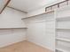 Walk-in closet with built-in shelving and ample storage space at 7621 S Bonarden Ln, Tempe, AZ 85284