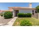 A charming home with a tiled roof, and a neatly landscaped front lawn at 7621 S Bonarden Ln, Tempe, AZ 85284