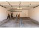 Spacious garage with ample storage and concrete floor at 7621 S Bonarden Ln, Tempe, AZ 85284