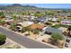 Aerial view of a cozy home in a quiet neighborhood with mature landscaping at 811 E Brown St, Phoenix, AZ 85020