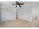Bright bedroom with wood flooring, closet, and ensuite bathroom at 811 E Brown St, Phoenix, AZ 85020