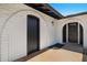 Home entrance showing arched doorways, stylish light fixtures, and modern design elements at 811 E Brown St, Phoenix, AZ 85020