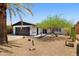 Charming single-story home with a well-kept yard, desert landscaping, and a two-car garage at 811 E Brown St, Phoenix, AZ 85020