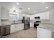 Bright kitchen featuring white cabinets, granite countertops, stainless steel appliances, and tile backsplash at 811 E Brown St, Phoenix, AZ 85020
