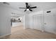 Open living area featuring light wood floors and an open layout to the kitchen at 811 E Brown St, Phoenix, AZ 85020