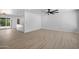 Open-concept living space with light wood floors, access to patio, and a bar area at 811 E Brown St, Phoenix, AZ 85020