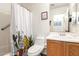 Bathroom with a shower and tub combination and decorative cactus shower curtain at 8609 W Eva St, Peoria, AZ 85345