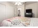This bedroom has a ceiling fan and easy access to a private bathroom at 8609 W Eva St, Peoria, AZ 85345