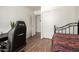 Bright bedroom features wood floors, neutral walls, and sliding closet doors at 8609 W Eva St, Peoria, AZ 85345