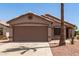 Charming single-story home featuring a two-car garage and desert landscaping at 8609 W Eva St, Peoria, AZ 85345