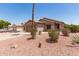 Single-story home with desert landscaping, palm tree, and attached two-car garage at 8609 W Eva St, Peoria, AZ 85345
