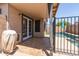 Covered patio with tile flooring and fenced access to a backyard pool at 8609 W Eva St, Peoria, AZ 85345