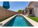 Inviting pool with blue tiles and artificial turf surrounds, perfect for relaxation and outdoor enjoyment at 8609 W Eva St, Peoria, AZ 85345