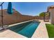 Inviting pool with blue tiles and artificial turf surrounds, perfect for relaxation and outdoor enjoyment at 8609 W Eva St, Peoria, AZ 85345