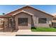 Back of home with pool, turf, and tile roof at 8609 W Eva St, Peoria, AZ 85345