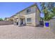 Two story home with a spacious gravel backyard and covered patio at 8769 W Washington St, Tolleson, AZ 85353