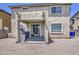 Two story home with a spacious gravel backyard and covered patio at 8769 W Washington St, Tolleson, AZ 85353
